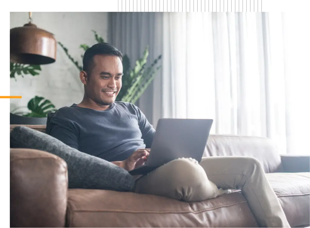 man on laptop shopping online life insurance